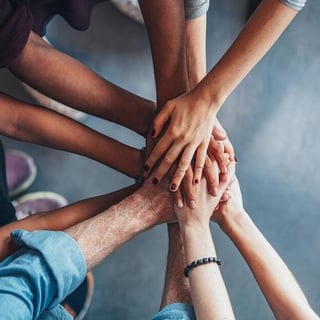 bigstock-stack-of-hands-showing-unity-a-153849635_0