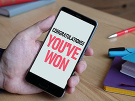 Fake lottery scam is shown using the congratulatory message you have won